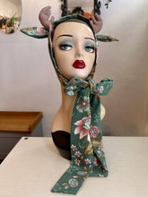 Load image into Gallery viewer, Mannequin head with floral deer antlers surrounded by decorative mushrooms and leaves.