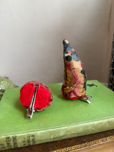 Load image into Gallery viewer, Mannequin head with black wig, red lipstick, and floral devil horns against a neutral background.