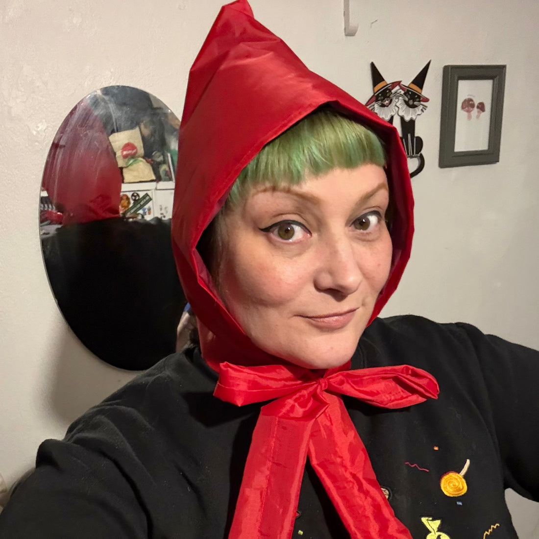 woman wearing red vintage style handmade rain hood