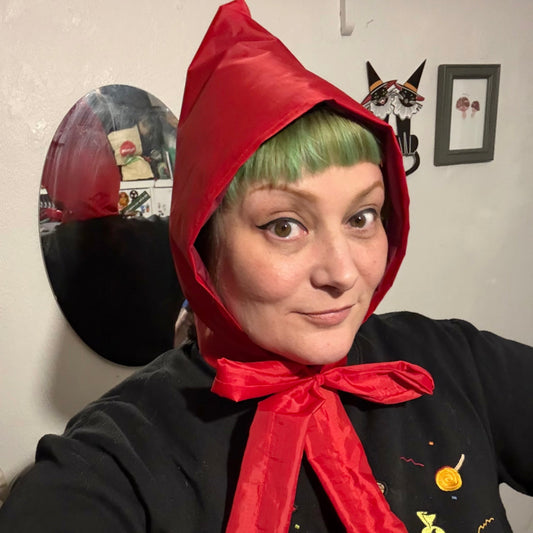 woman wearing red vintage style handmade rain hood