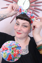 Load image into Gallery viewer, Woman tying a blue floral 1940s handmade vintage headscarf