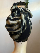 Load image into Gallery viewer, Black and gray striped headscarf on a mannequin head against a plain background