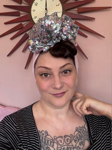 Women wears pink sparkly vintage turban 