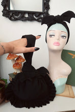 Load image into Gallery viewer, Hand with gothic nails holding a black ruffle bag