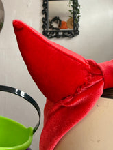 Load image into Gallery viewer, Red fabric bow on a white surface with a blurred background