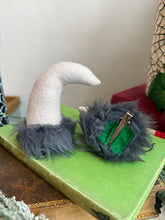 Load image into Gallery viewer, Mannequin head with black wig, red lipstick, and Krampus devil horns on a festive winter background.