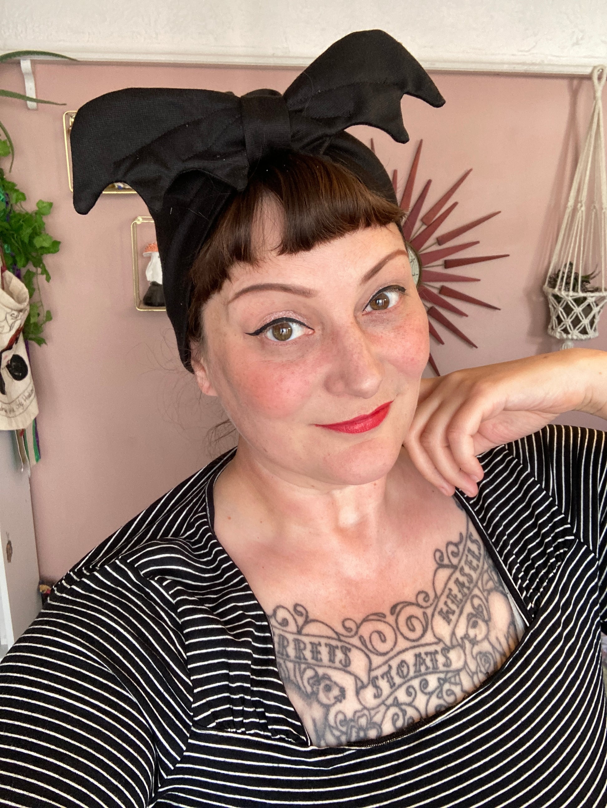 Women wears bat Halloween alt fashion hat accessory
