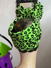 Load image into Gallery viewer, Green leopard print headband on a mannequin head with a plain background
