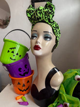 Load image into Gallery viewer, Mannequin head with Halloween-themed green headband and buckets on a white surface.