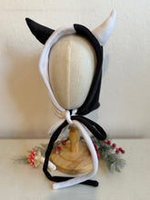 Load image into Gallery viewer, Black and white devil horn hood on a mannequin head with a neutral background
