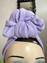 Load image into Gallery viewer, Mannequin head wearing lilac turban with Halloween-themed decorations 