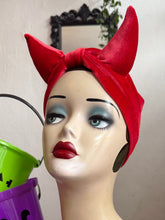 Load image into Gallery viewer, Mannequin head wearing a red devil horn headband with Halloween buckets in the background.