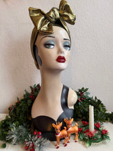 Load image into Gallery viewer, Mannequin head with gold headscarf, Christmas decorations, and deer figurines in background
