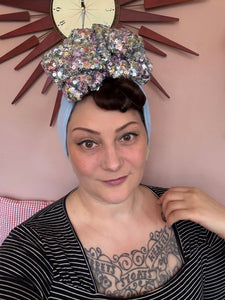 Women wears blue sparkly vintage turban 