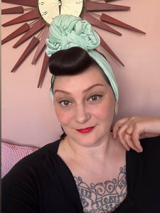 Woman wears mint vintage style headband 