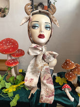 Load image into Gallery viewer, display head with floral deer antler headband surrounded by decorative mushrooms and leaves.