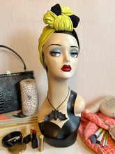 Load image into Gallery viewer, Mannequin head with chartreuse headband 
