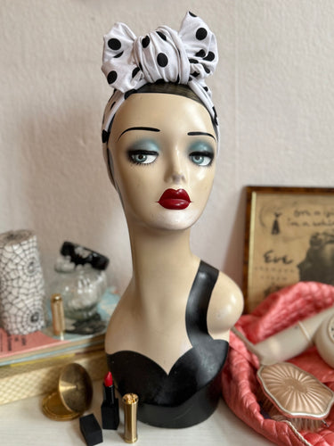 Mannequin head with a polka dot headband