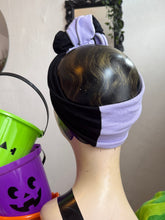 Load image into Gallery viewer, Mannequin head with black and white marbled wig, purple headband, and Halloween-themed buckets in the background.