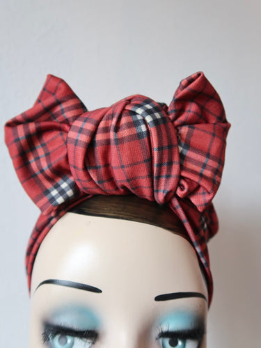 vintage display head, wears tartan headband